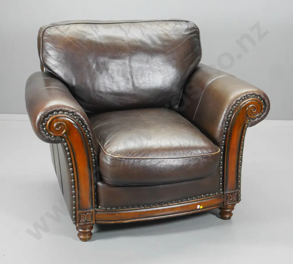 antiqued finish brown leather Chesterfield style club chair w/ carved timber facings H-880 W-1060 D-940 Image 1++
