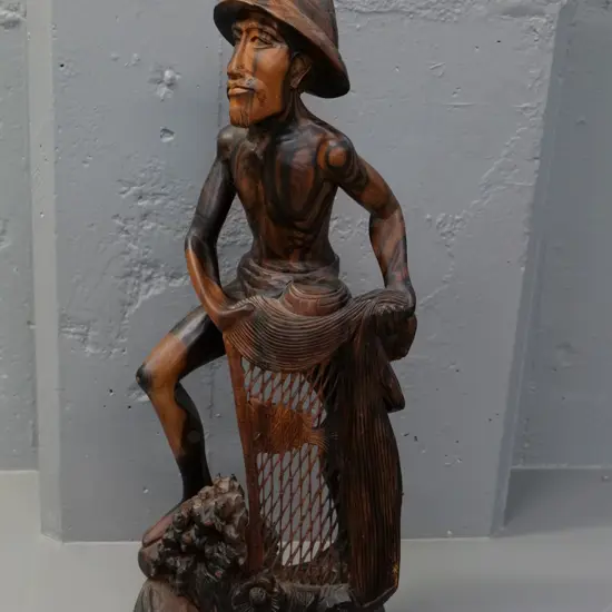 hand carved asian hardwood figure of man with fishing net - H-600 W-240 - a few bits of netting broken