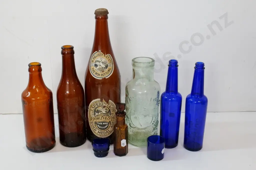 assorted vintage bottles and a small blue glass eye bath - incl. Speights Moa with part label H310, Ballans, Lanes, etc. Image 1++