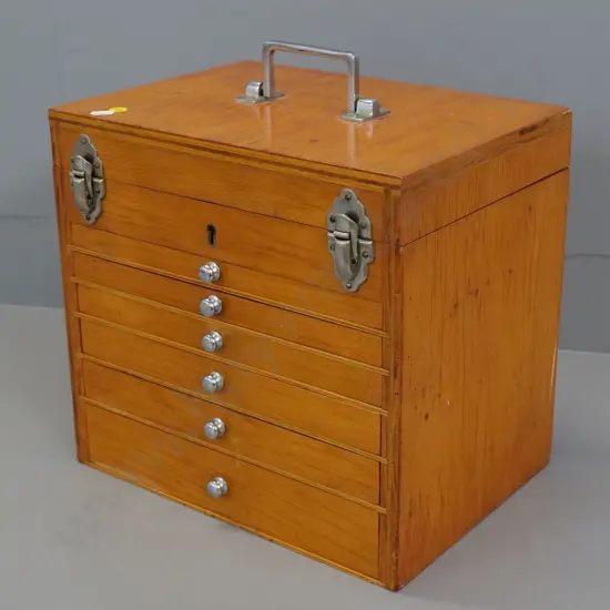 small plywood chest with top compartment & 6 drawers, rod drawer lock, no key, some dividers loose H310 W330 D240