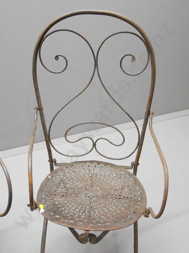 4 wrought iron French style collapsible cafe chairs w/stamped seats, one w/damage to arm bracket H1030 W520 D520 Image 1++