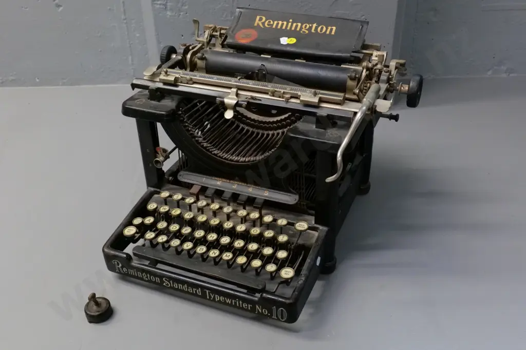 vintage Remington Standard No. 10 typewriter - one foot has come off Image 1++