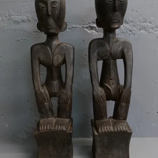 pair of carved hardwood figures from Borneo - male and female, each H-670