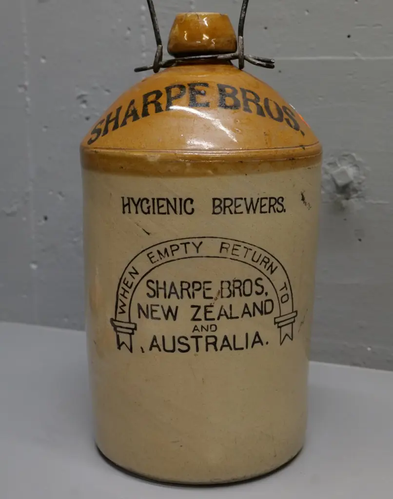 Sharp Brothers NZ & Australia narrow mouth stoneware crock with wire handle, some chips to rim H-360 Image 1++
