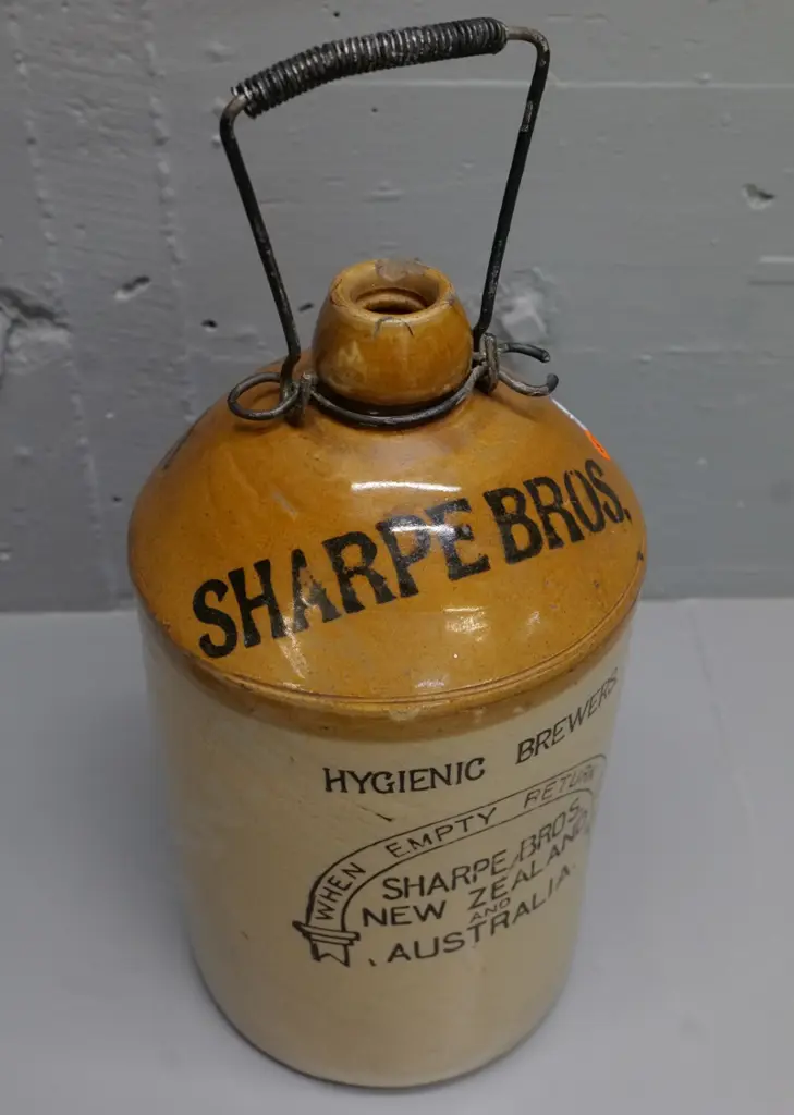 Sharp Brothers NZ & Australia narrow mouth stoneware crock with wire handle, some chips to rim H-360 Image 1++