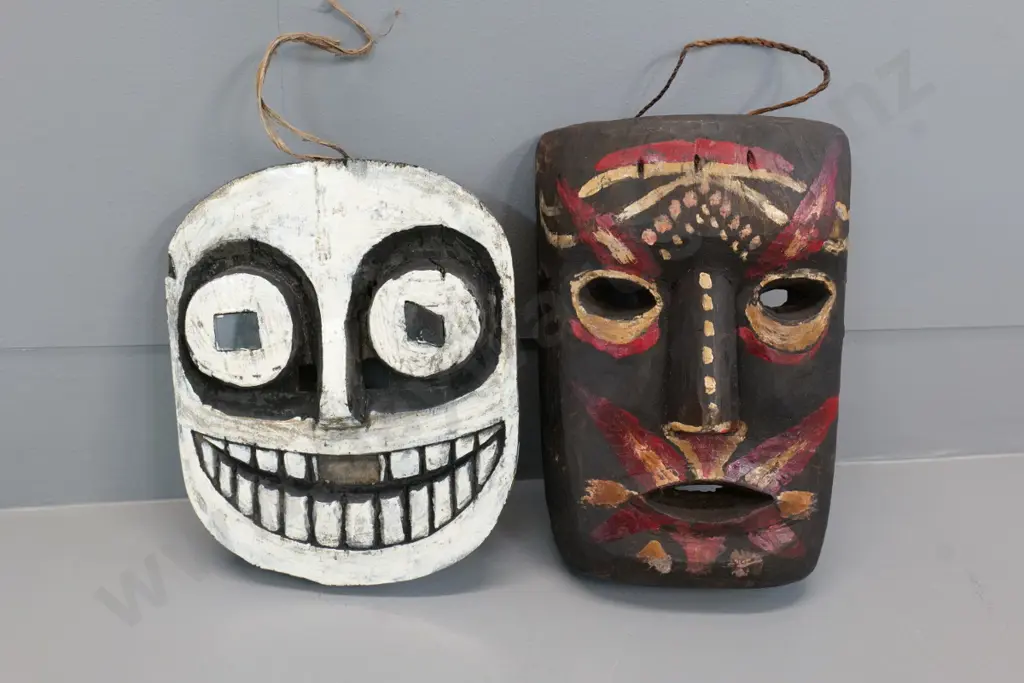 2 painted wood wall masks from Borneo - taller is H-250 Image 1++