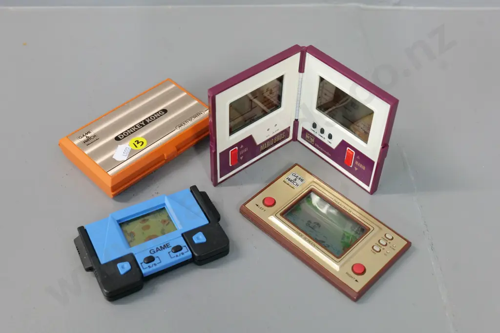 4 retro handheld electronic arcade games - Nintendo Donkey Kong, Mario Brothers, and Parachute plus one other Image 1++