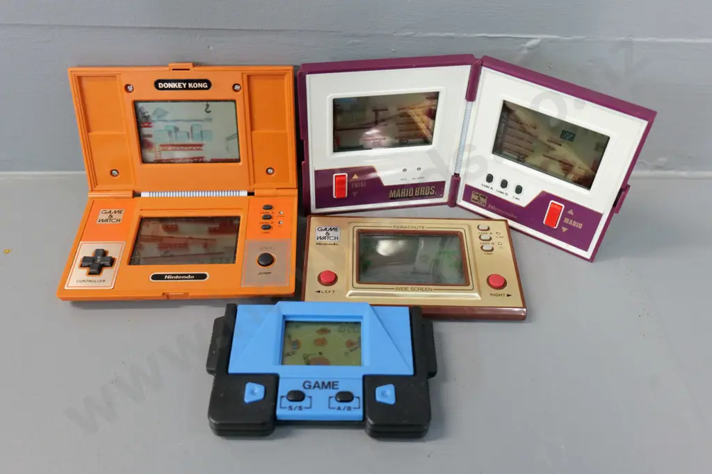 4 retro handheld electronic arcade games - Nintendo Donkey Kong, Mario Brothers, and Parachute plus one other Image 1++