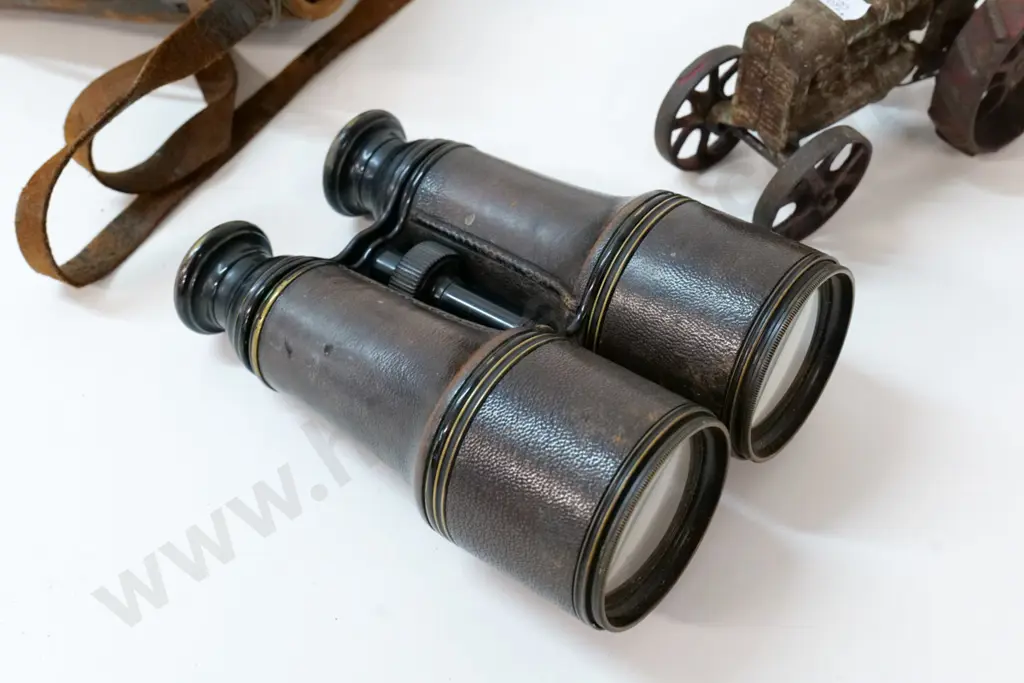 restorer's toy tractor with metal wheels, driver has lost his head, & vintage binoculars in worn leather case Image 1++