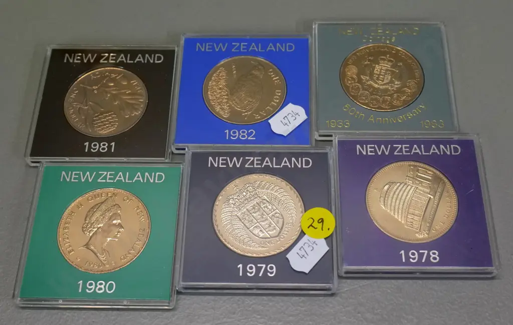 6 cased New Zealand collector's dollar coins - 1978, 1979, 1980, 1981 Royal Visit, 1982, 1983 50th Anniversay of coinage Image 1++
