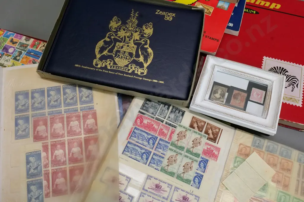 assorted stamp albums including New Zealand mint, framed Victorian New Zealand, Zeapex 80 anniversary set, etc. Image 1++