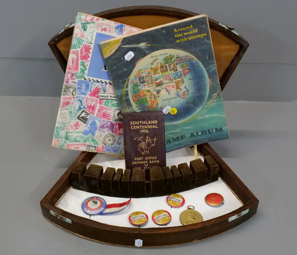 1956 Southland Centennial post office money box (bent) 2 stamp albums, badges, etc. w/ wooden cutlery case Image 1++
