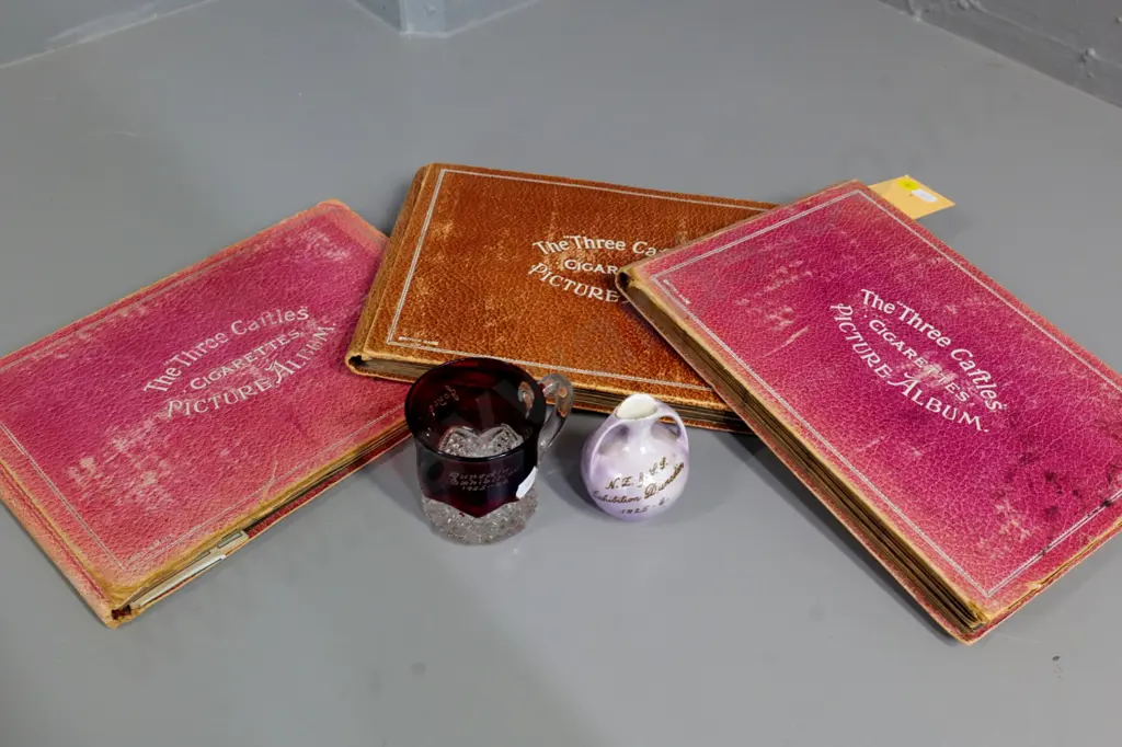 2 pieces 1925-26 Dunedin Exhibition ware and 3 Three Castles cigarette card albums with partial contents Image 1++