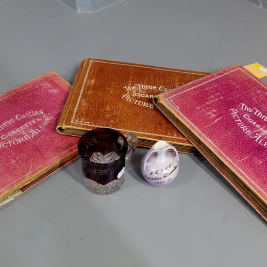 2 pieces 1925-26 Dunedin Exhibition ware and 3 Three Castles cigarette card albums with partial contents