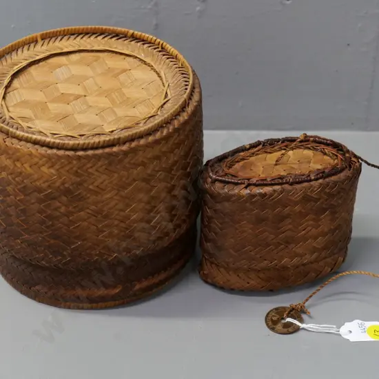 2 small woven cane baskets including small rice steamer with pierced French Indo-China coin on strap, larger H150 D160