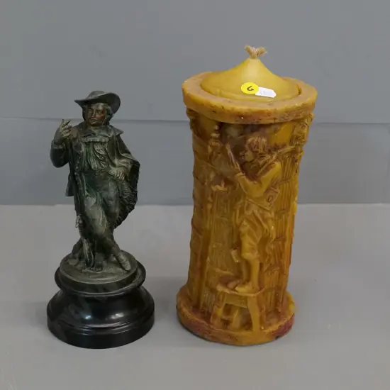 cast metal musketeer figure on wooden base H210 & a wax candle with fuel-burning candle fitting inside and wax lid H-230