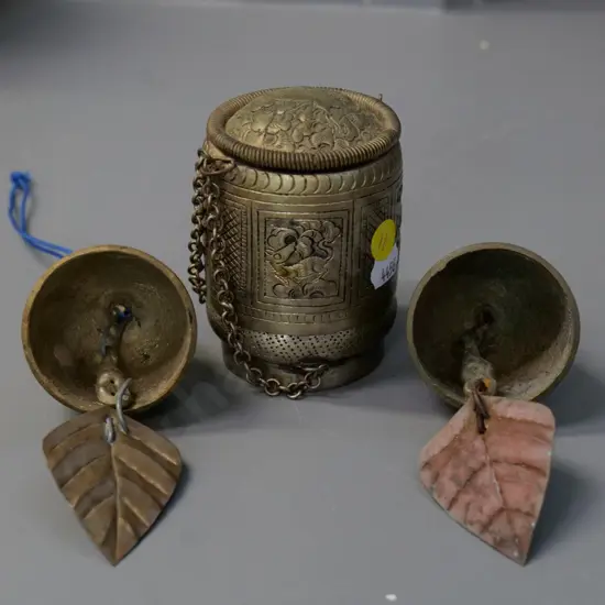 3 asian items - pair of brass bells and a repousse decorated betel nut container H-85