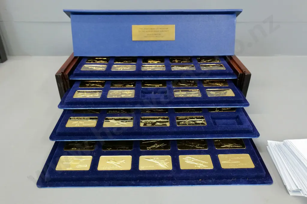 cased set of 'Janes Medallic Register' World's Great Aircraft gold-on-bronze ingots - two are missing Image 1++