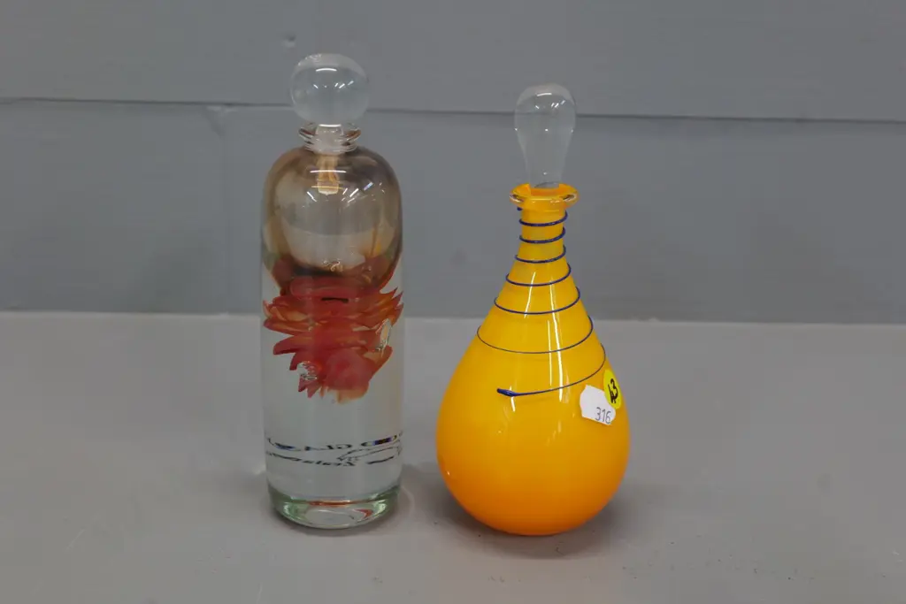 2 art glass scent bottles, one heavy clear based Hoglund H-170 and an unmarked orange with blue swirl Image 1++