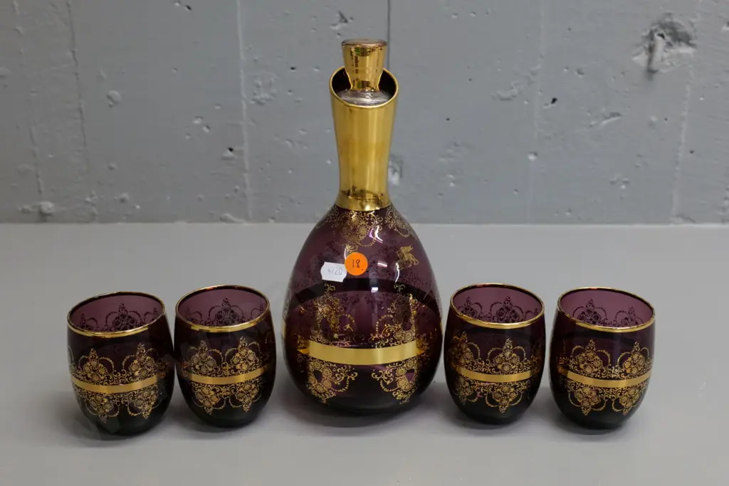 amethyst glass & gold design stoppered decanter w/4 tumblers - some rubbing to gilt Image 1++