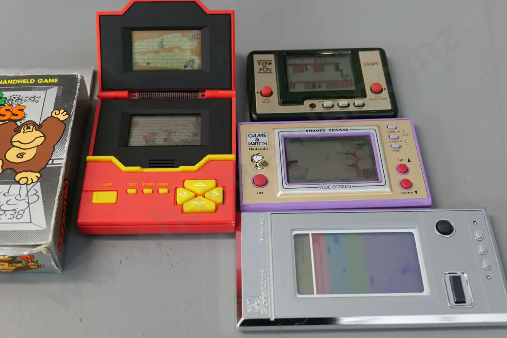 4 retro handheld electronic arcade games - Nintendo Snoopy Tennis & Softball Sparky, Escape, and 2-panel Hero & Princess Image 1++