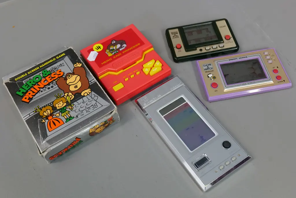 4 retro handheld electronic arcade games - Nintendo Snoopy Tennis & Softball Sparky, Escape, and 2-panel Hero & Princess Image 1++