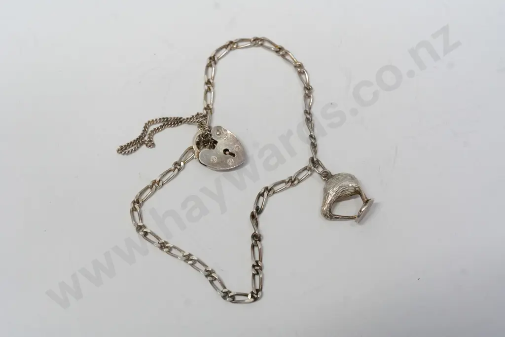 silver charm bracelet with a kiwi charm Image 1++