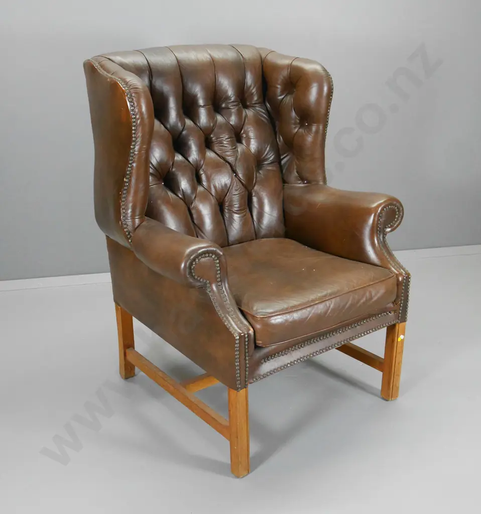 brown leather wing club chair with deep button back, studding, some rubbing to leather H1140 W880 D810 Image 1++