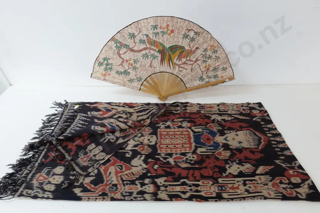 Indonesian Ikat figural fabric wall hanging approx. 2200 x 1120 and a wood and fabric fan with bird motif Image 1++