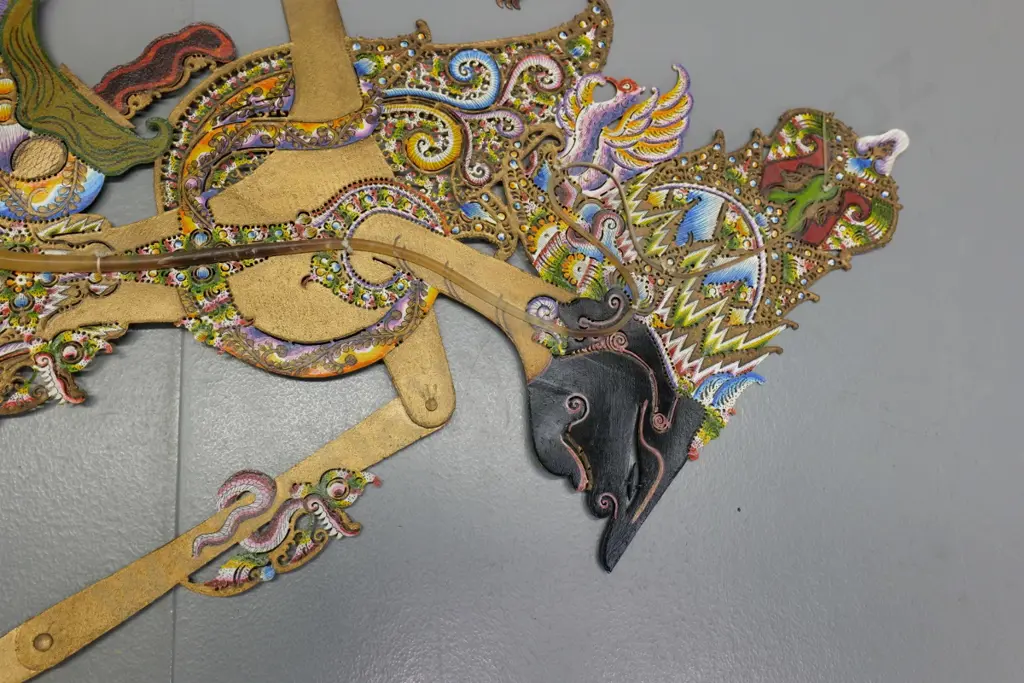 3 Indonesian shadow puppets - one painted leather with horn handles H-730 and two painted wood Image 1++