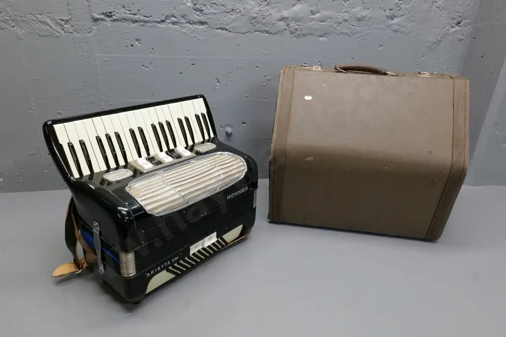 Hohner Arietta IIM piano accordion with hard case - damage to case, repairs to bellows, missing a closure strap Image 1++
