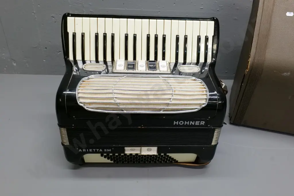 Hohner Arietta IIM piano accordion with hard case - damage to case, repairs to bellows, missing a closure strap Image 1++