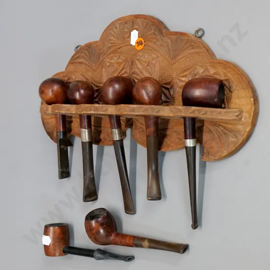 chip-carved wall hanging pipe rack H-150 W-300 and 7 assorted smoker's pipes