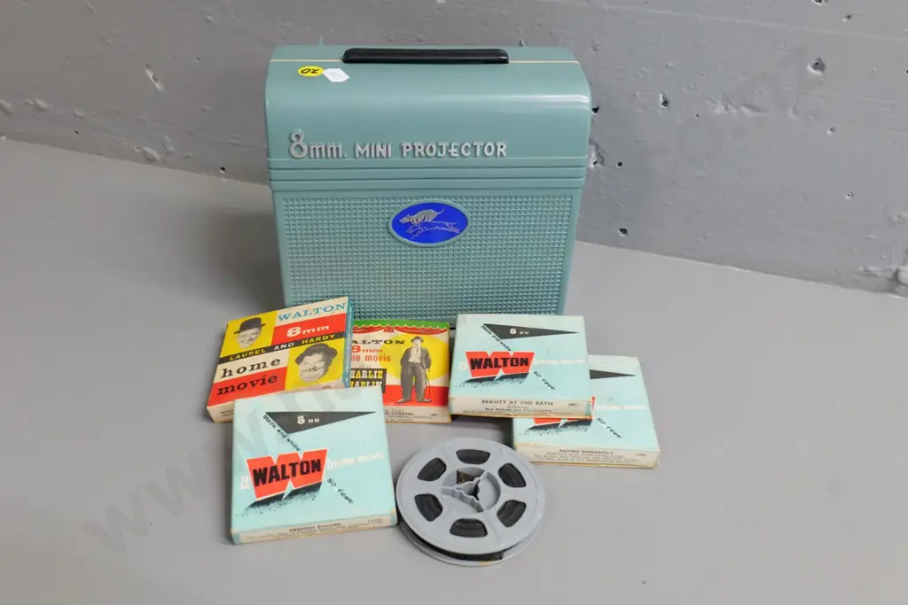 retro hand-wind child's 8mm mini projector and 6 small film reels - not working, needs new rubber belt Image 1++