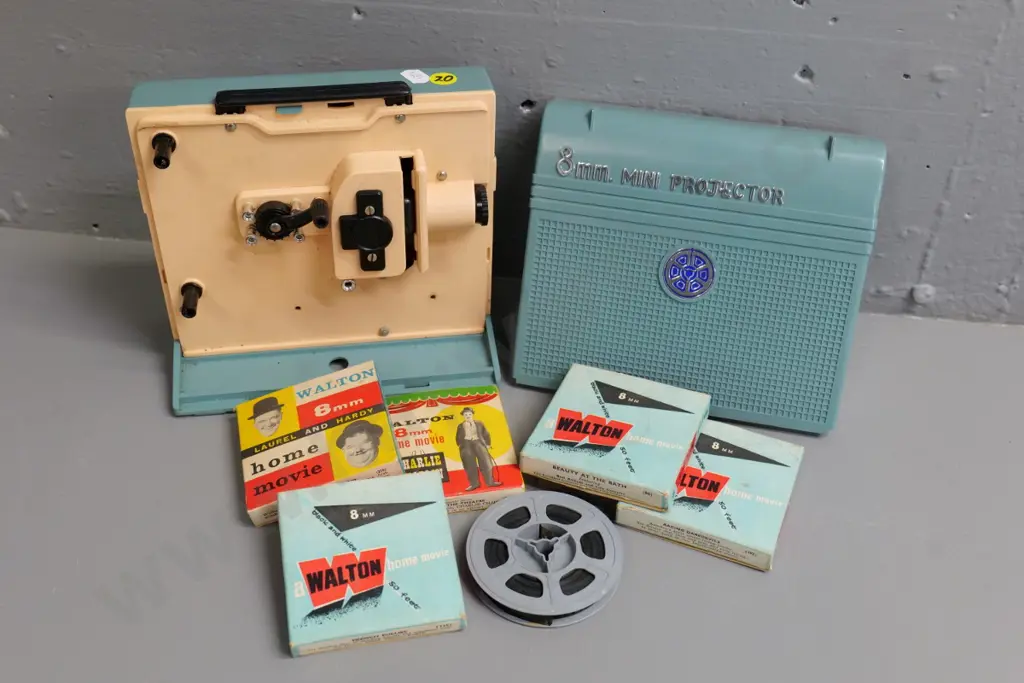 retro hand-wind child's 8mm mini projector and 6 small film reels - not working, needs new rubber belt Image 1++