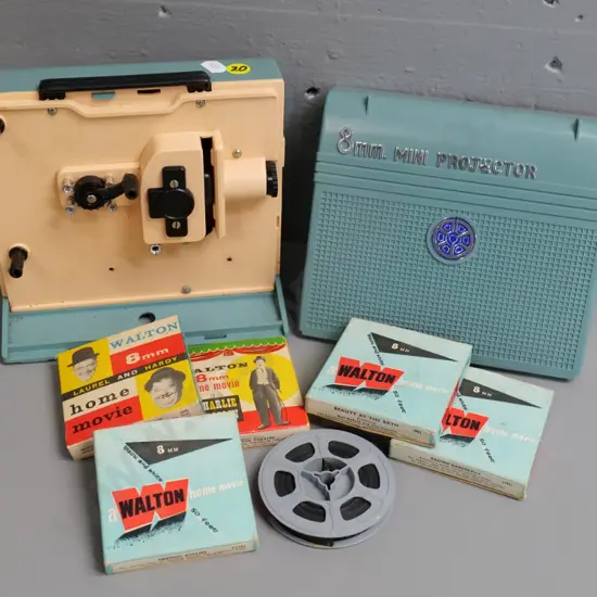 retro hand-wind child's 8mm mini projector and 6 small film reels - not working, needs new rubber belt
