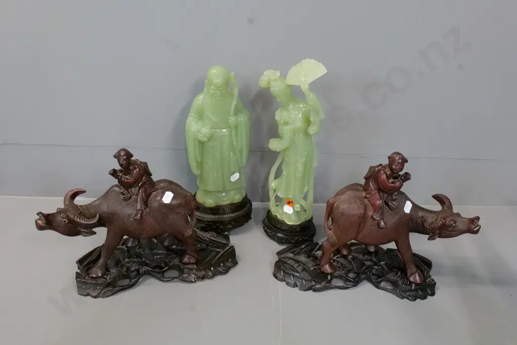pair of composite/plastic figurines H-320 & a pair of carved wood water buffalo on stands, one ear missing Image 1++