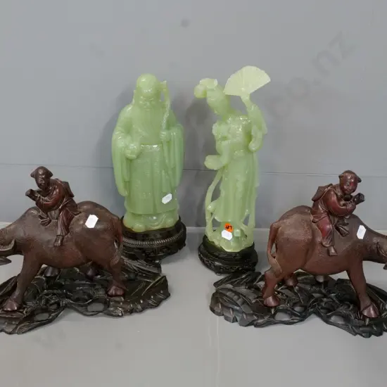 pair of composite/plastic figurines H-320 & a pair of carved wood water buffalo on stands, one ear missing
