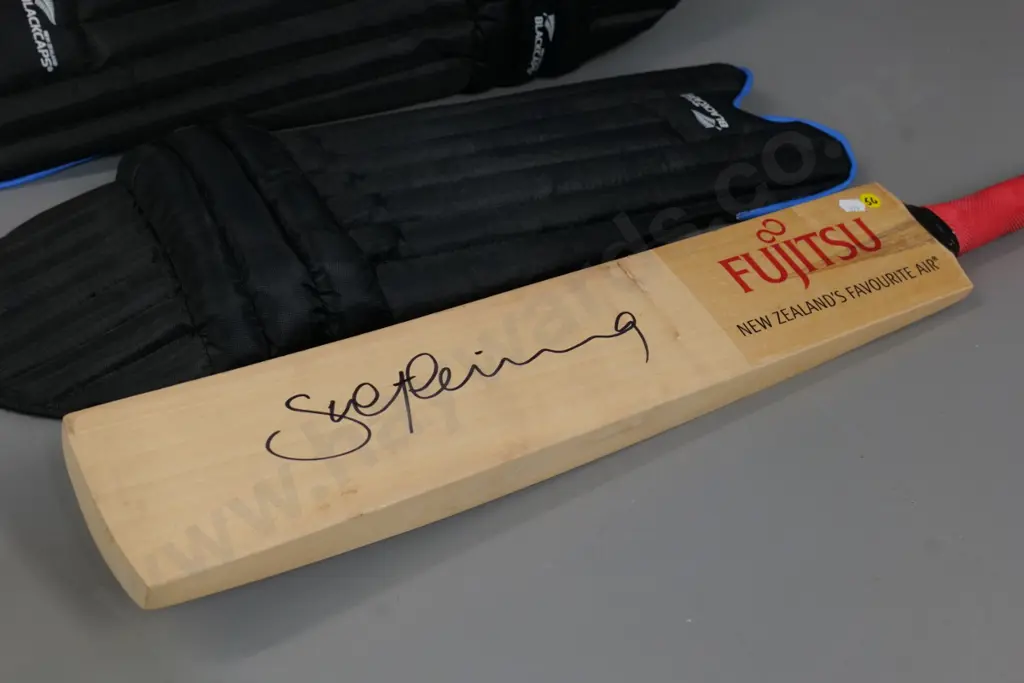 promotional Fujitsu cricket bat signed by Stephen Fleming and pair Black Caps branded shin guards marked youth Image 1++