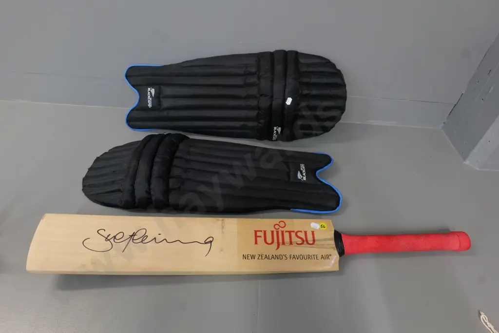 promotional Fujitsu cricket bat signed by Stephen Fleming and pair Black Caps branded shin guards marked youth Image 1++