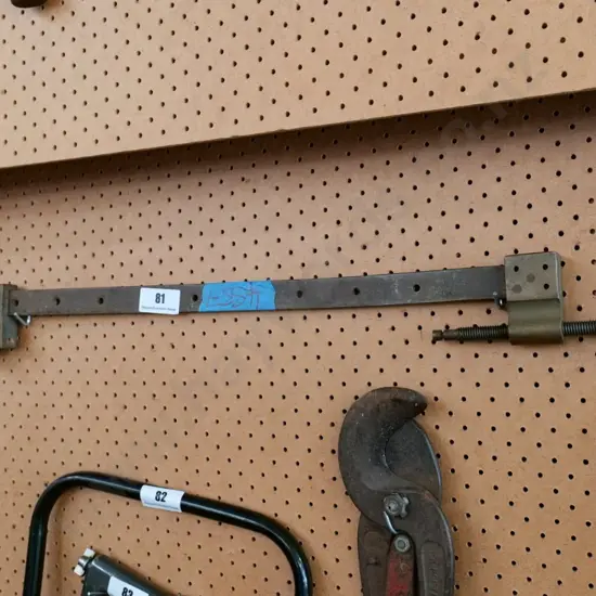 small metal and brass sash clamp