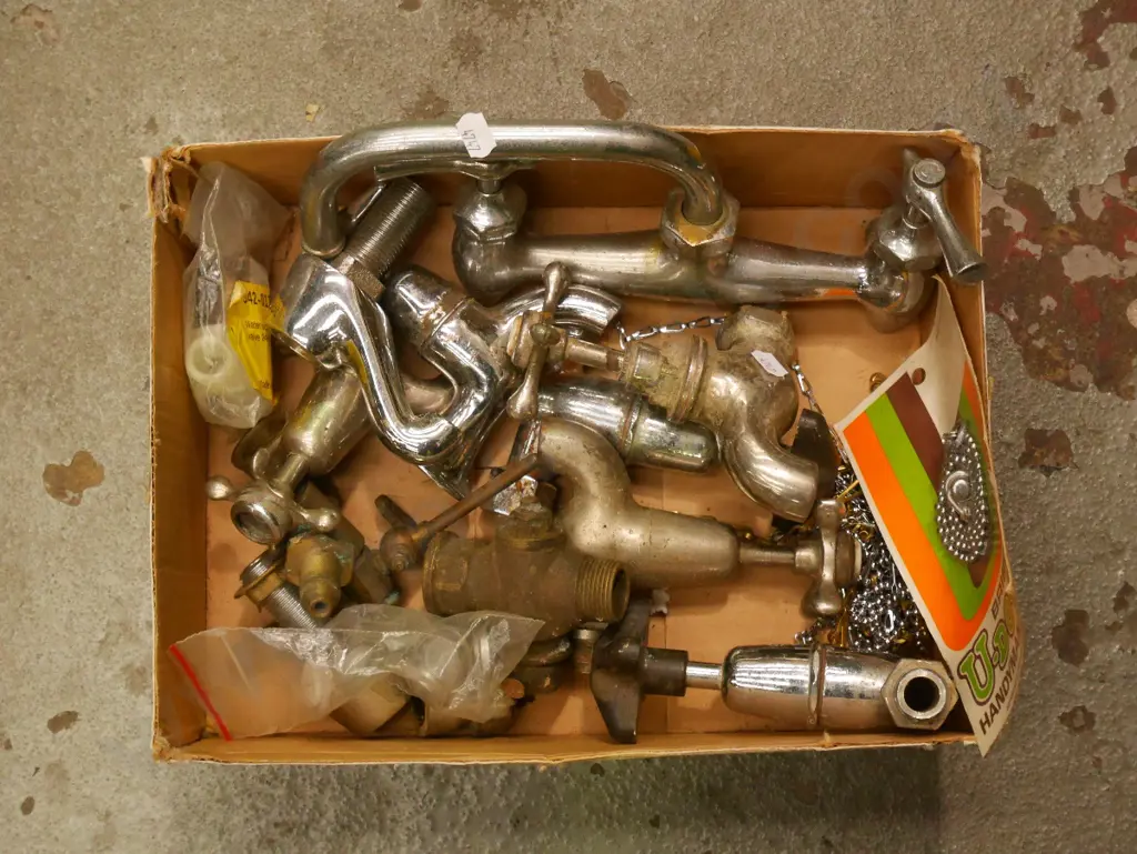 box of plumbing supplies, plug chains etc Image 1++