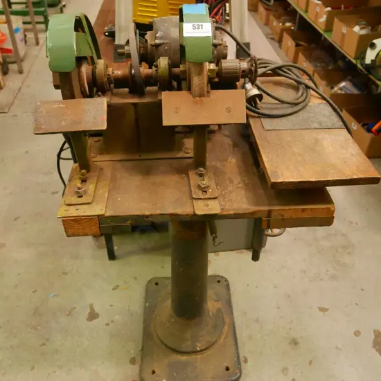 bench grinder on cast iron stand