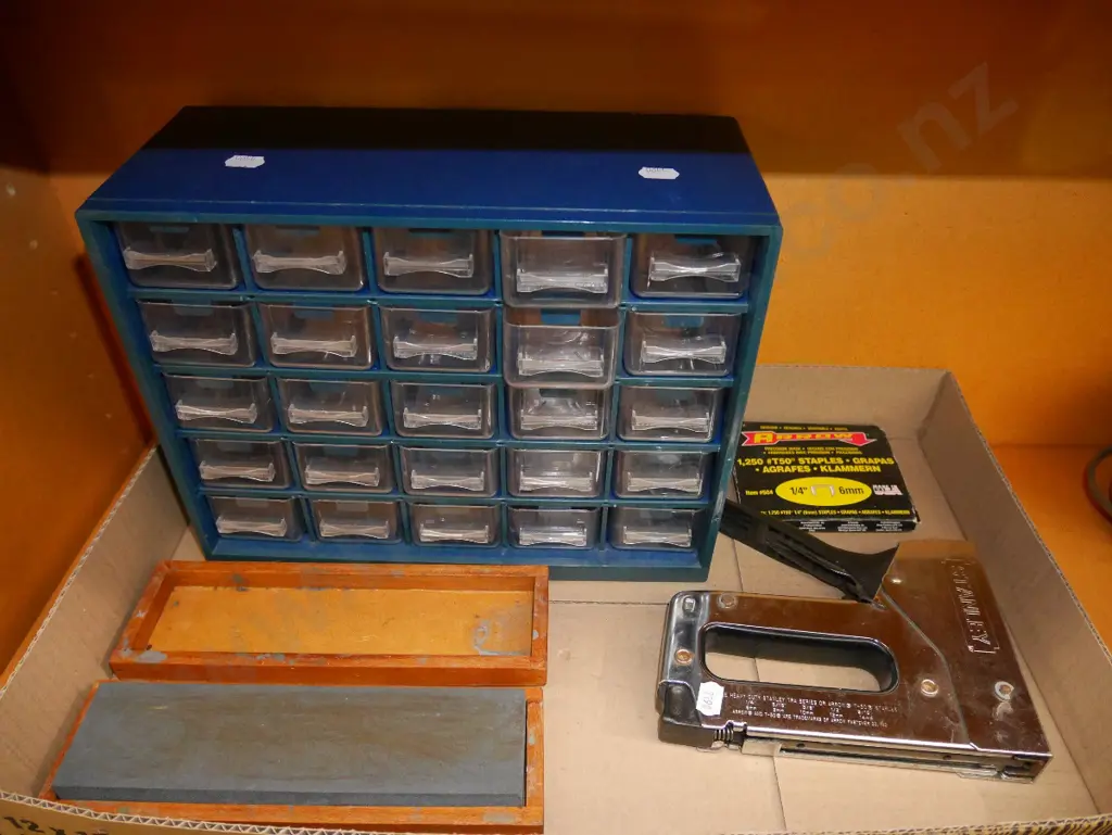 small plastic storage trays, sharpening stone, staple gun Image 1++