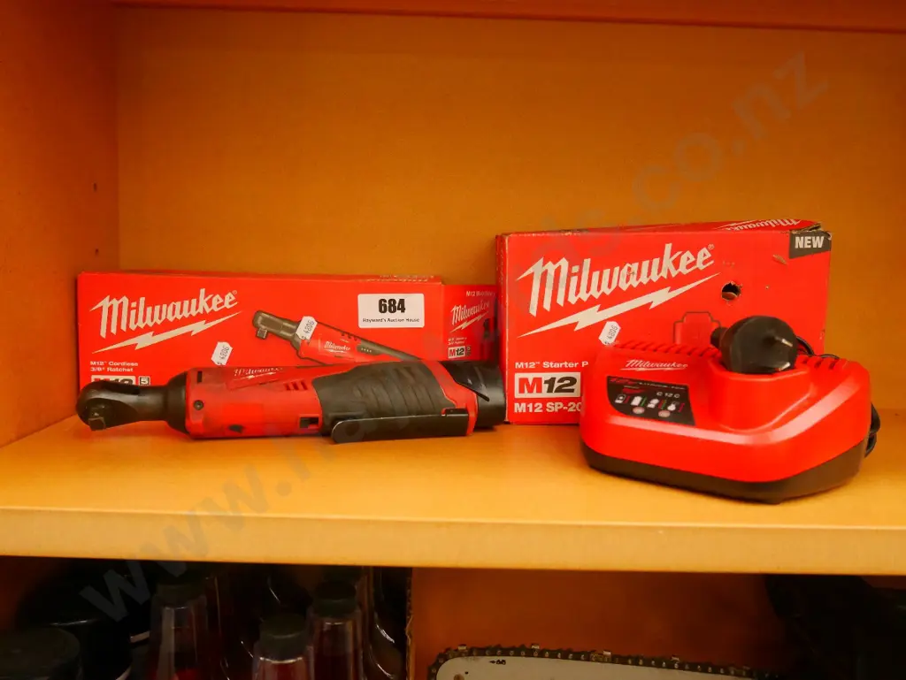 Milwaukee battery powered wrench and charger Image 1++