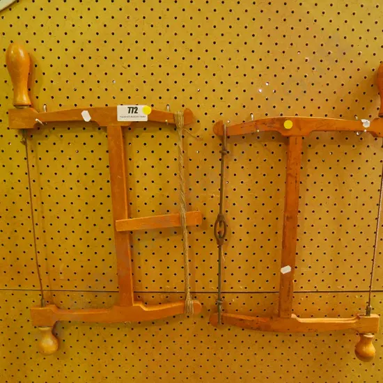 2 wooden bow saws - yelllow dots