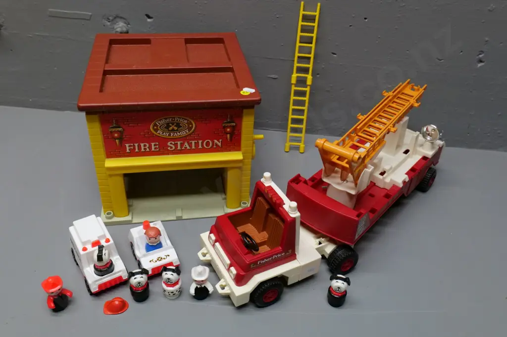 assorted Fisher-Price toys - fire station, fire truck and assorted figures and smaller vehicles. Fire truck H-200 L-500 Image 1++