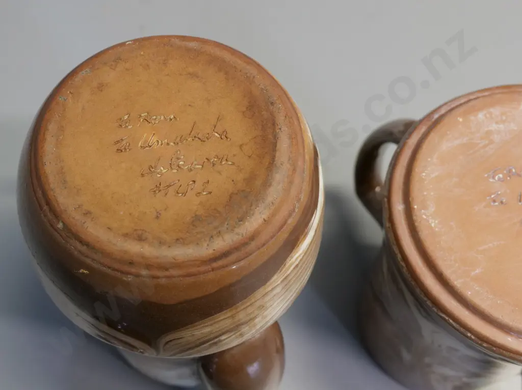 Temuka pottery - 2 Te Rona brown swirl coffee pots, taller one has chip to spout H250 W200 Image 1++
