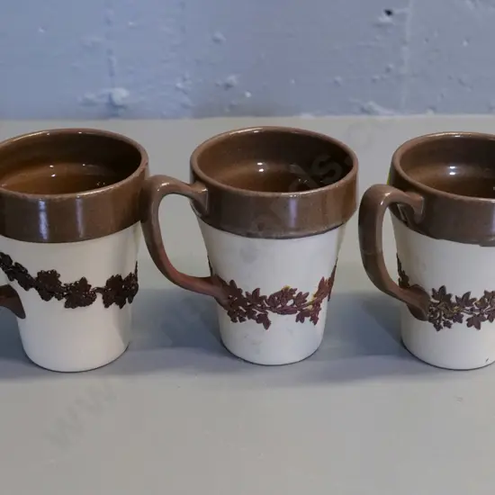 Temuka pottery - 3 brown & cream jasperware mugs - marked Lovatt's, one has piece of relief missing H100