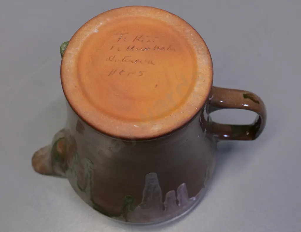 Temuka pottery - green and brown trickle glaze jug, Maori inscription on base & model #CP5 H190 W240 Image 1++